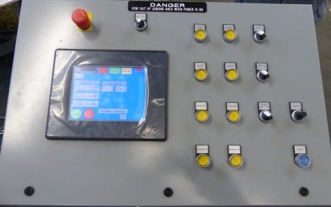 Control panel with buttons and screen for industrial equipment, only available at Woodward invented the Pile Turner and Jogger Aerator over 63 years ago, and has over 5,000.